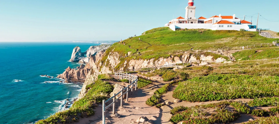 Cabo da Roca, the westernmost point of mainland Europe, with its iconic lighthouse, rugged cliffs, and Atlantic Ocean views in Portugal.