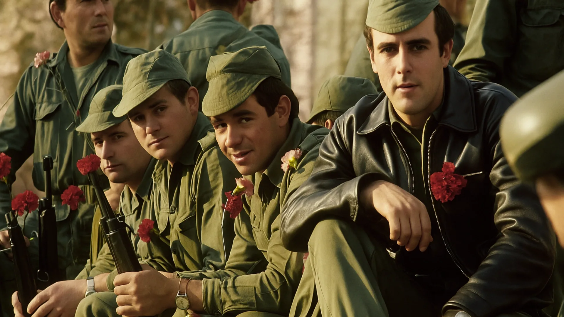 Portuguese soldiers in uniform with red carnations in their rifles, symbolizing the peaceful Carnation Revolution of April 25, 1974.