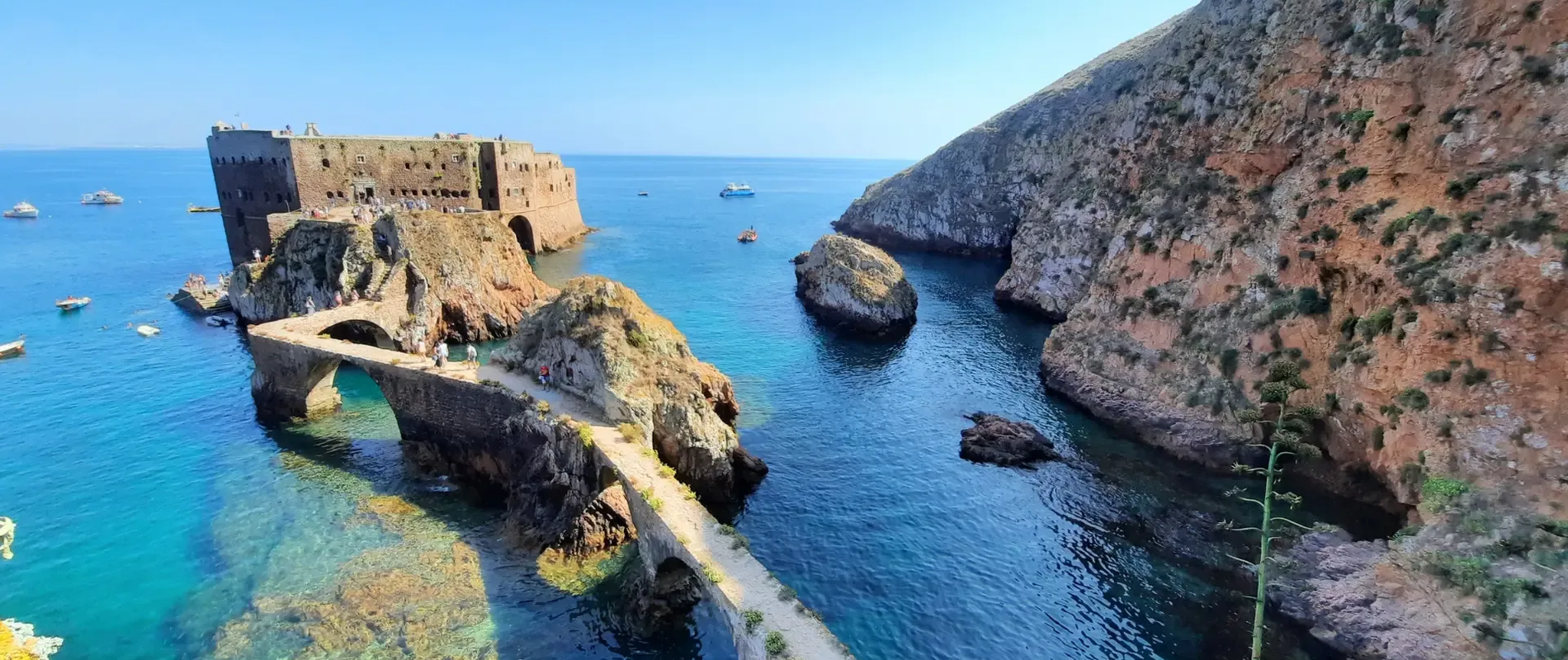 Fort of São João Baptista on Berlenga Grande Island, connected by a stone bridge and surrounded by the crystal-clear waters of the Berlengas archipelago.