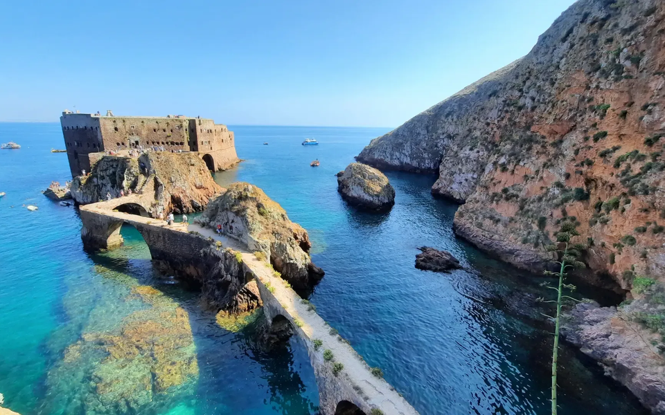 Fort of São João Baptista on Berlenga Grande Island, connected by a stone bridge and surrounded by the crystal-clear waters of the Berlengas archipelago.