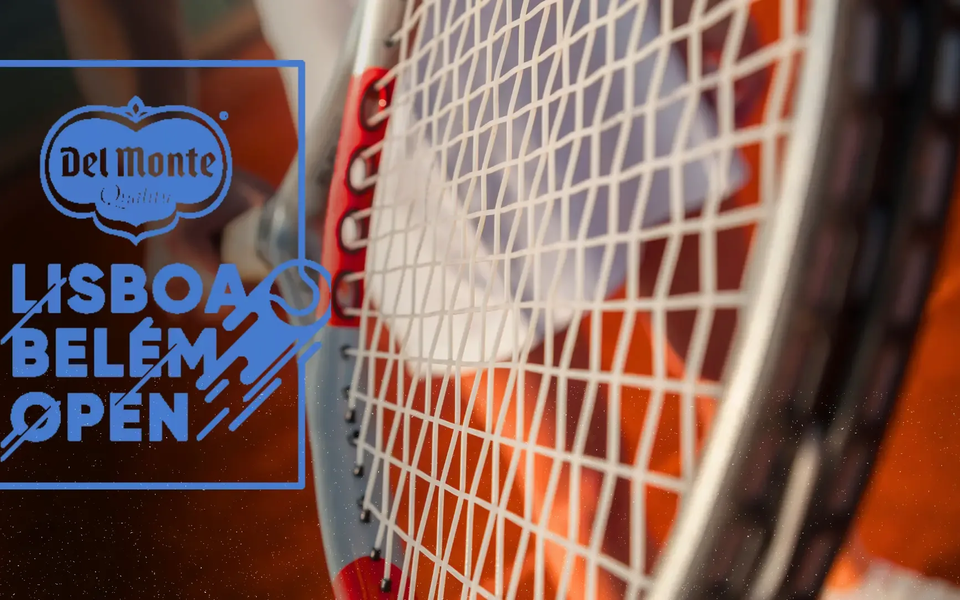 Tennis racket close-up over a clay court background with the Lisbon Belém Open logo and Del Monte branding in blue overlay.