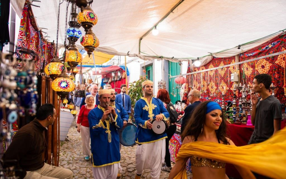 Musicians and belly dancer perform at the traditional market during the Islamic Festival of Mértola