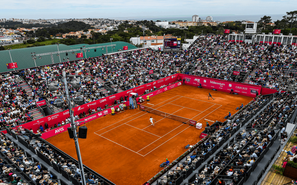 Full crowd at the Millennium Estoril Open tennis stadium with sea view in Cascais