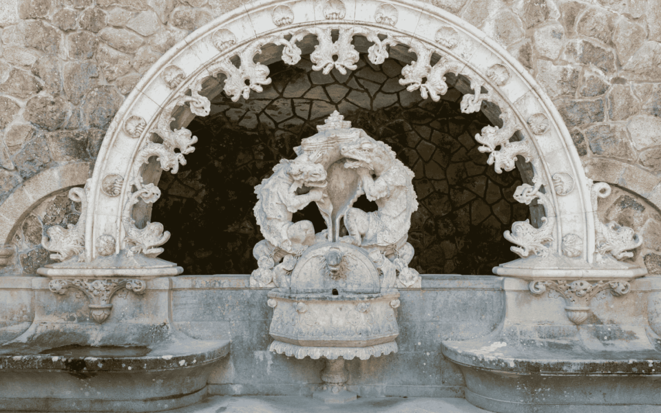 Close-up of the mythological animal sculpture at the Guardians’ Portal in Quinta da Regaleira, Sintra, Portugal, featuring ornate gothic details.