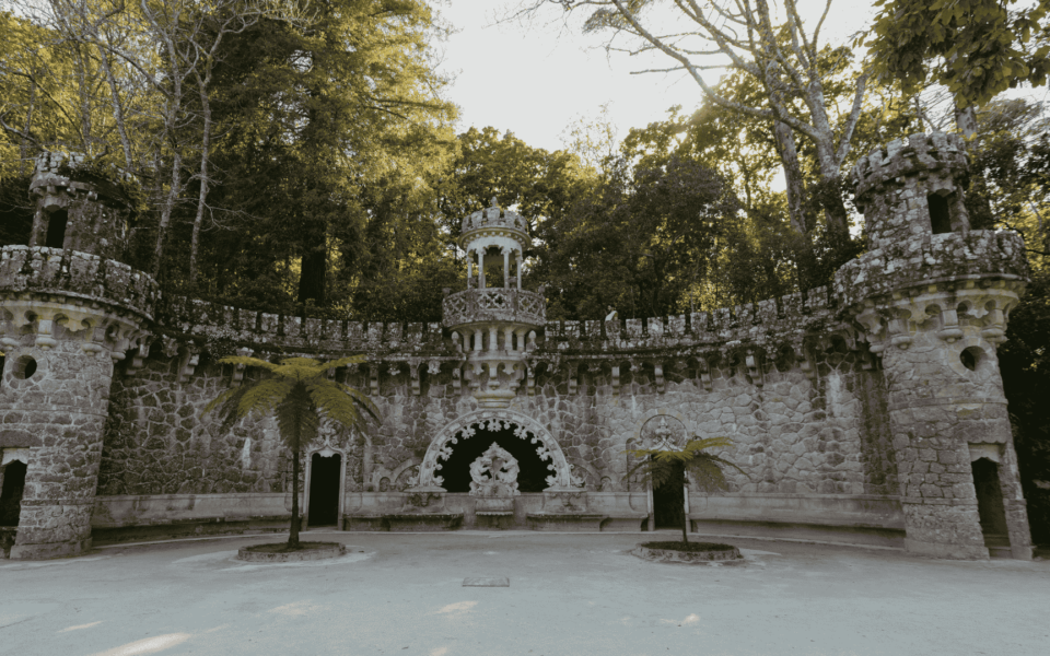 Elaborate Portal of the Guardians at Quinta da Regaleira in Sintra, Portugal, featuring mythological stone creatures and symbolic neo-manueline architecture.